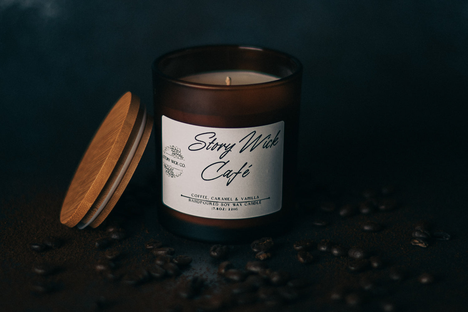 Candle with a label on a dark background with coffee beans
