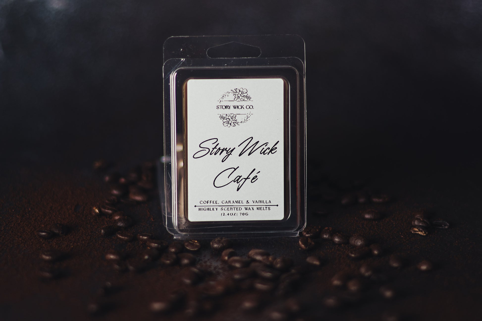 Story Wick Cafe wax melt packaging with coffee beans on a dark background.