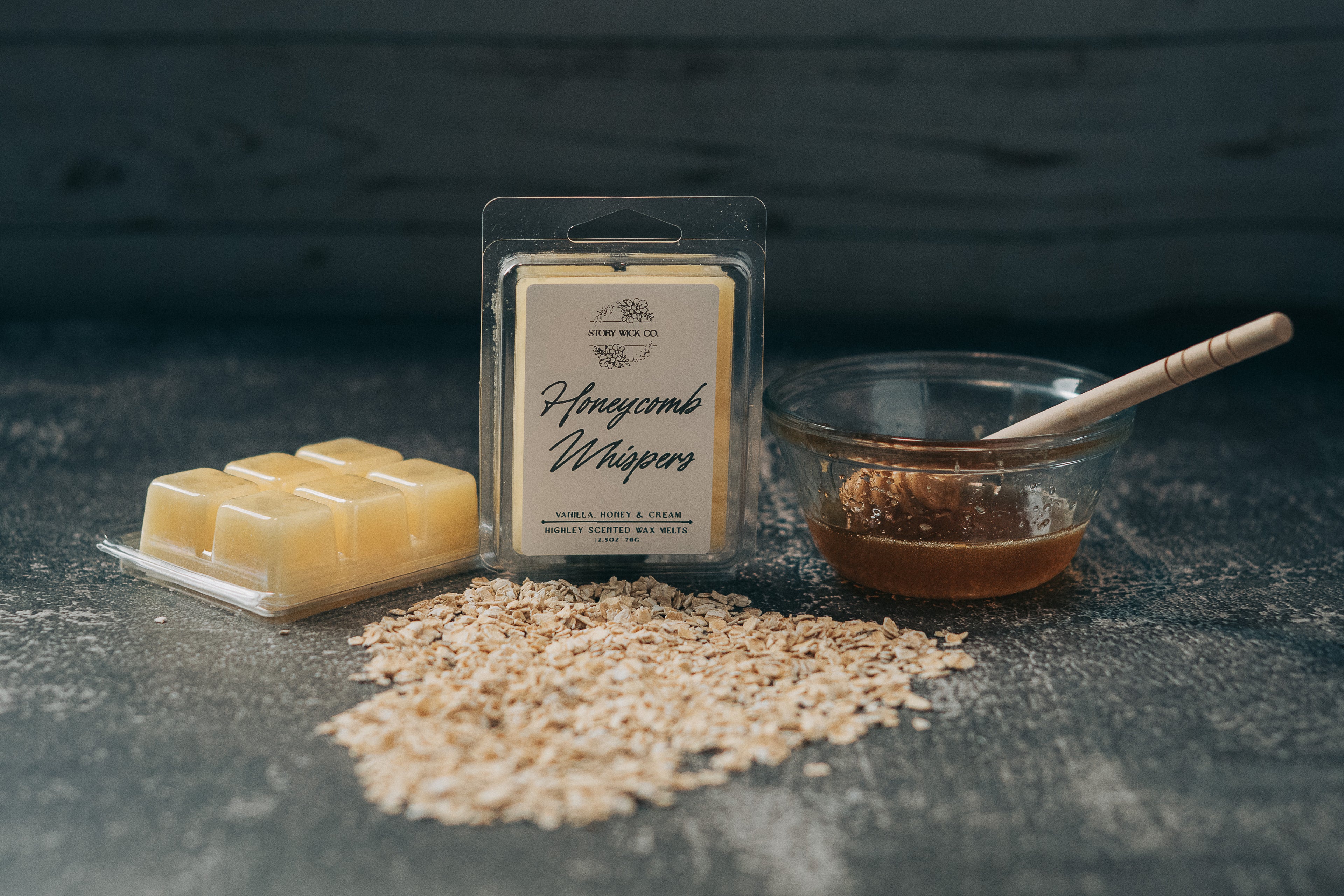 Honeycomb Whispers wax melts packaging with honeycomb pieces and a bowl on a dark surface.